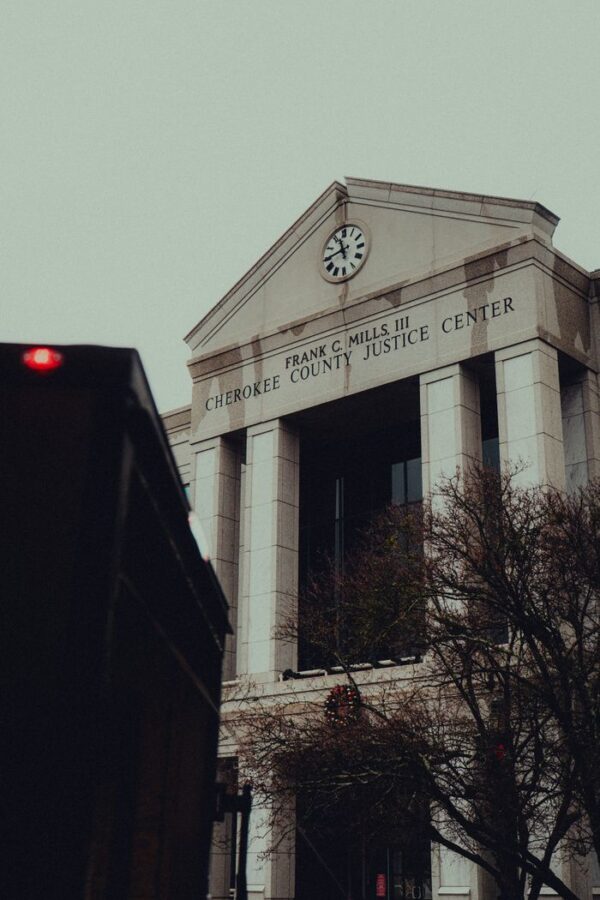 pexels-photo-35285712-35285712 A dramatic view of the Cherokee County Justice Center under cloudy skies in Canton, Georgia.